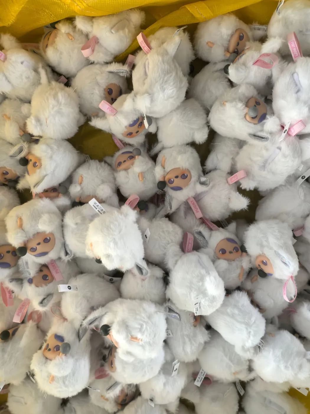 Bulk run of cream and white character charms