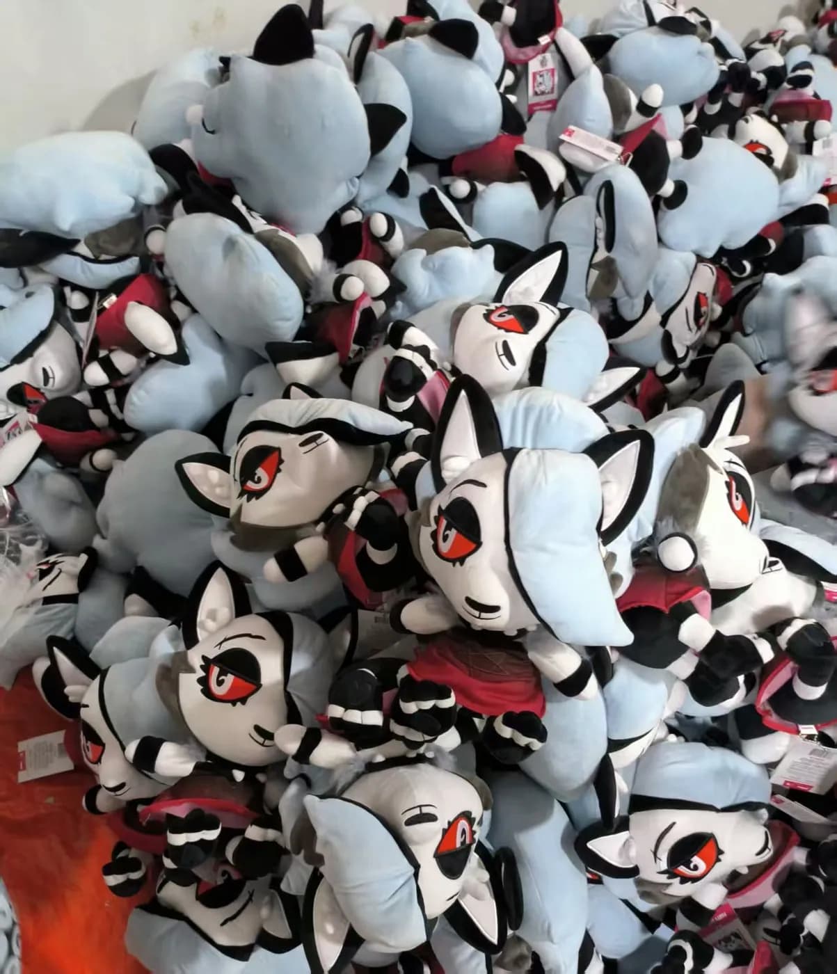 Bulk run of fox character charms on the packing table