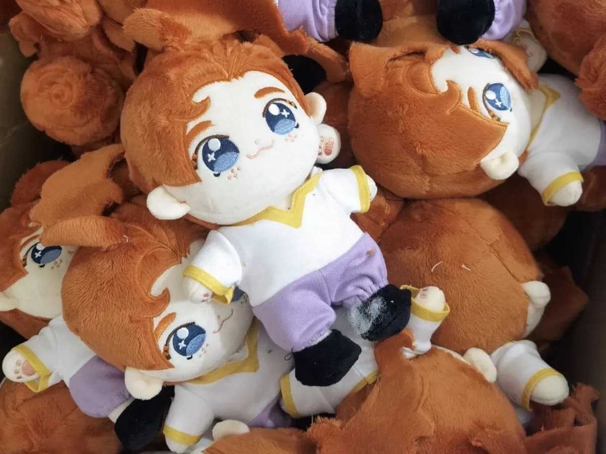 Bulk run of orange and white character plush