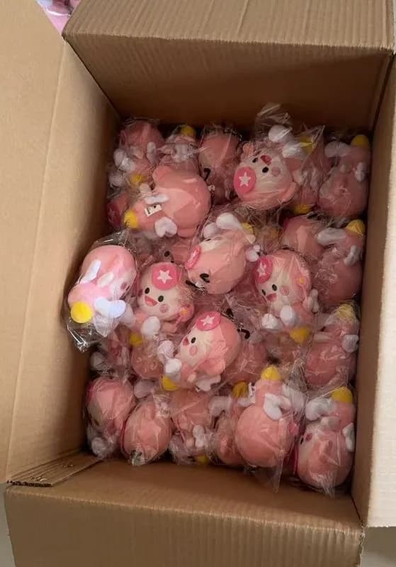 Pink plush charms bagged and boxed for shipment