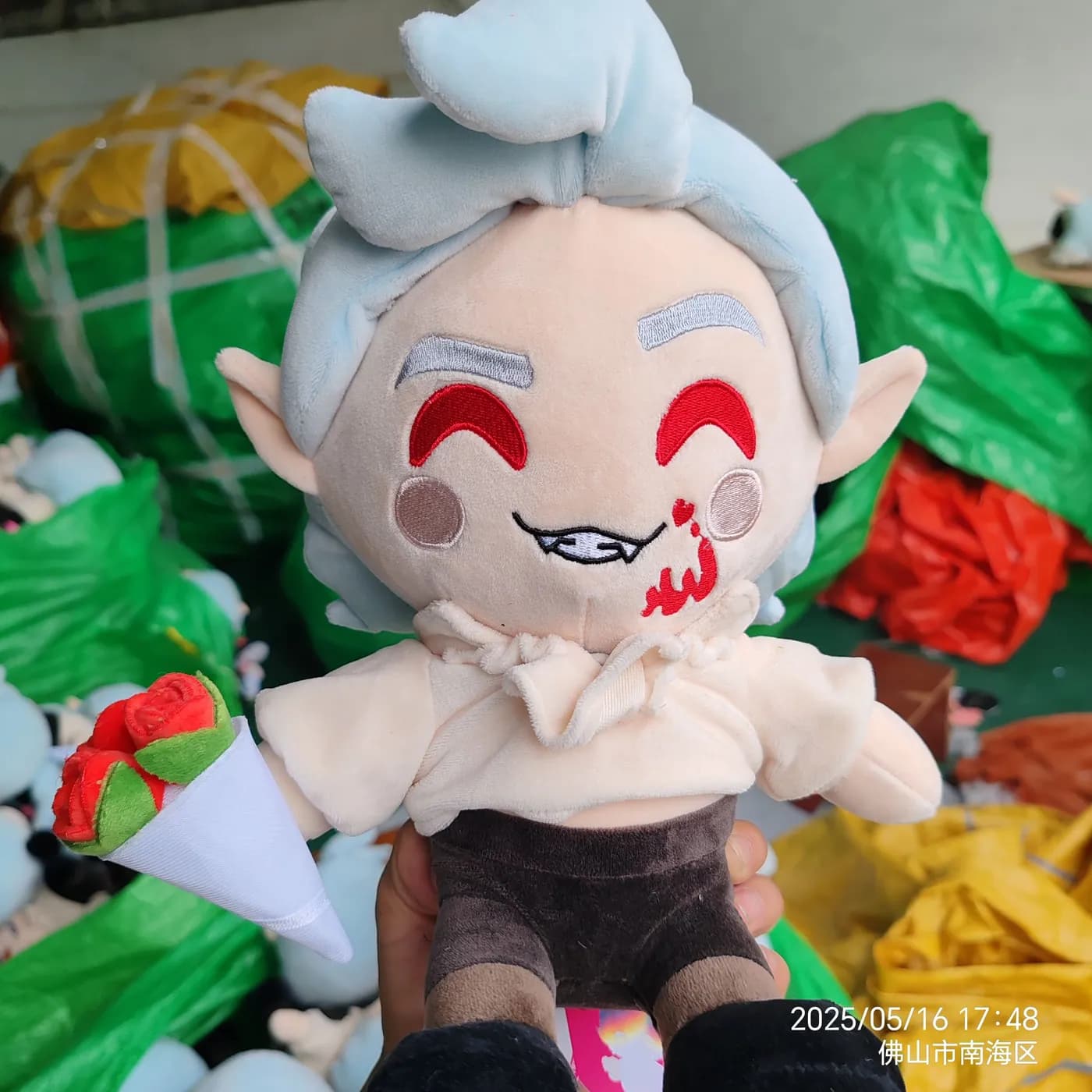 Character doll with wefted white hair and a printed costume