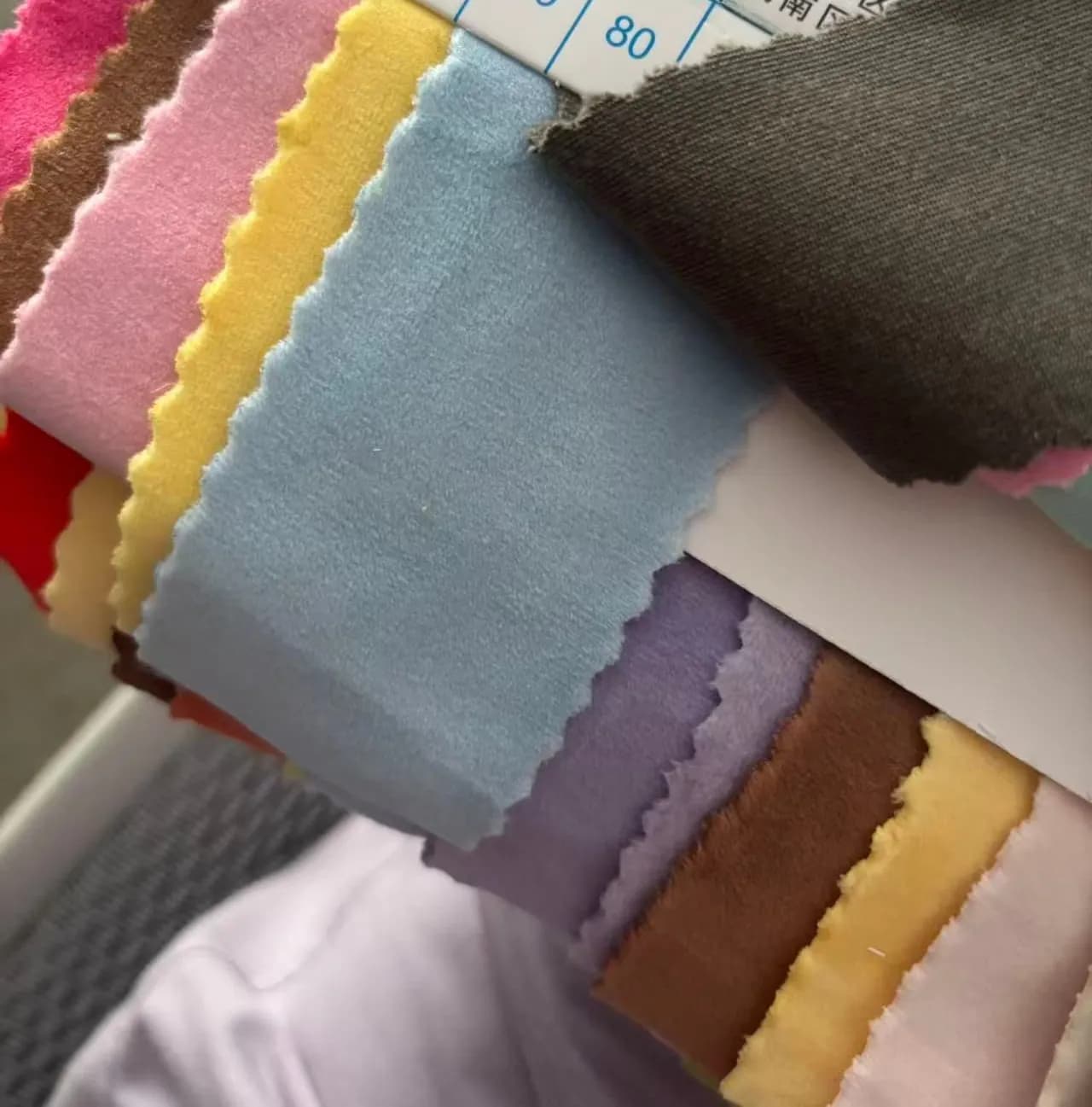 Plush fabric swatch card in neutral and blush colourways