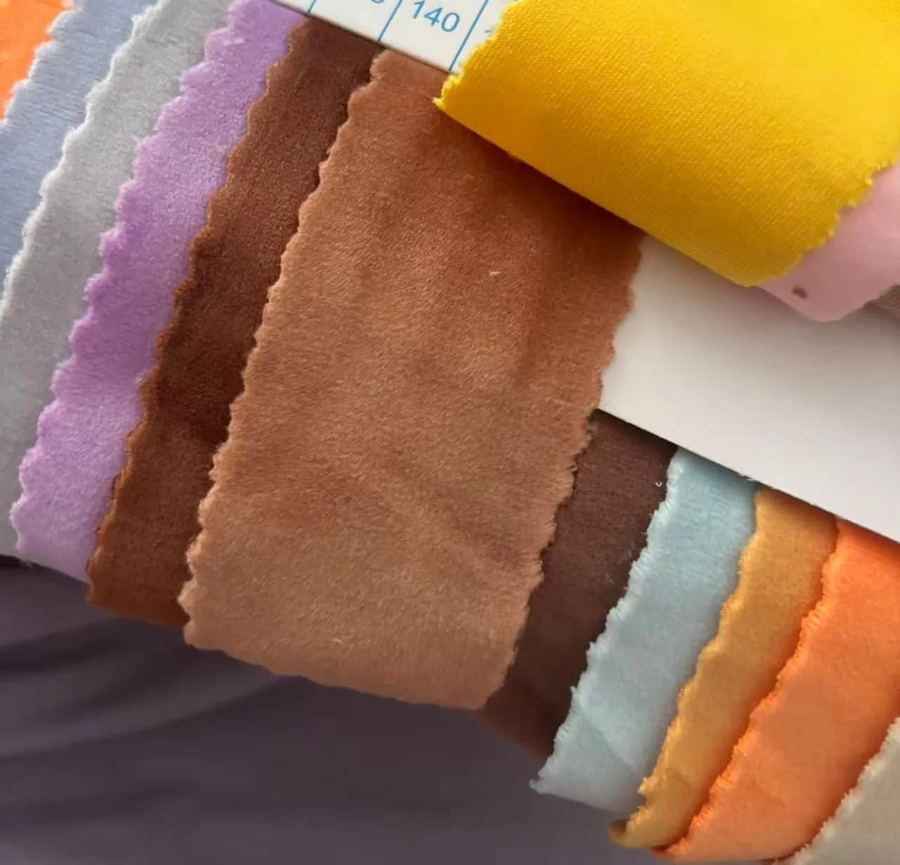 Numbered plush fabric swatch book used for colour matching